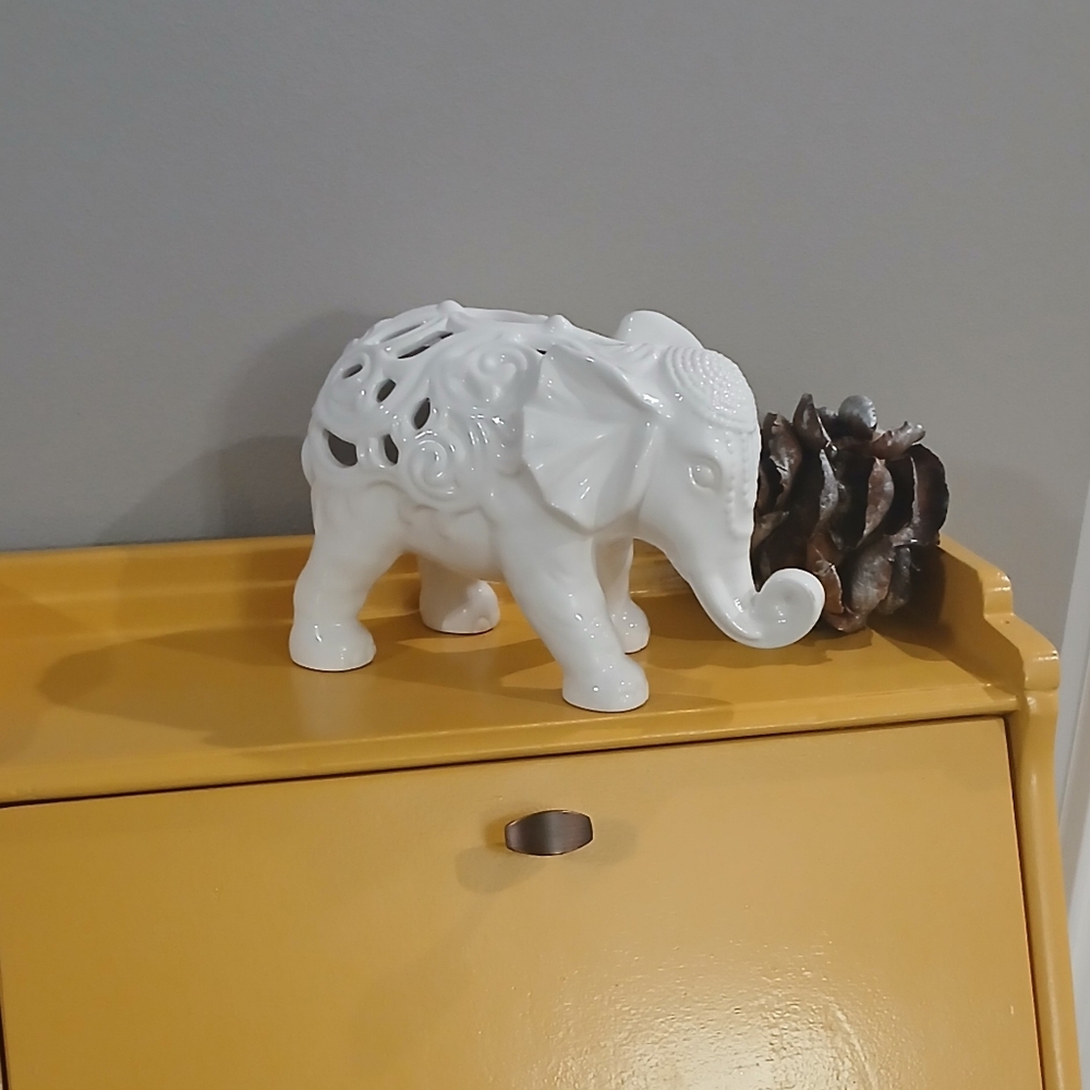 White ceramic bohemian elephant with embossed Swirl design.